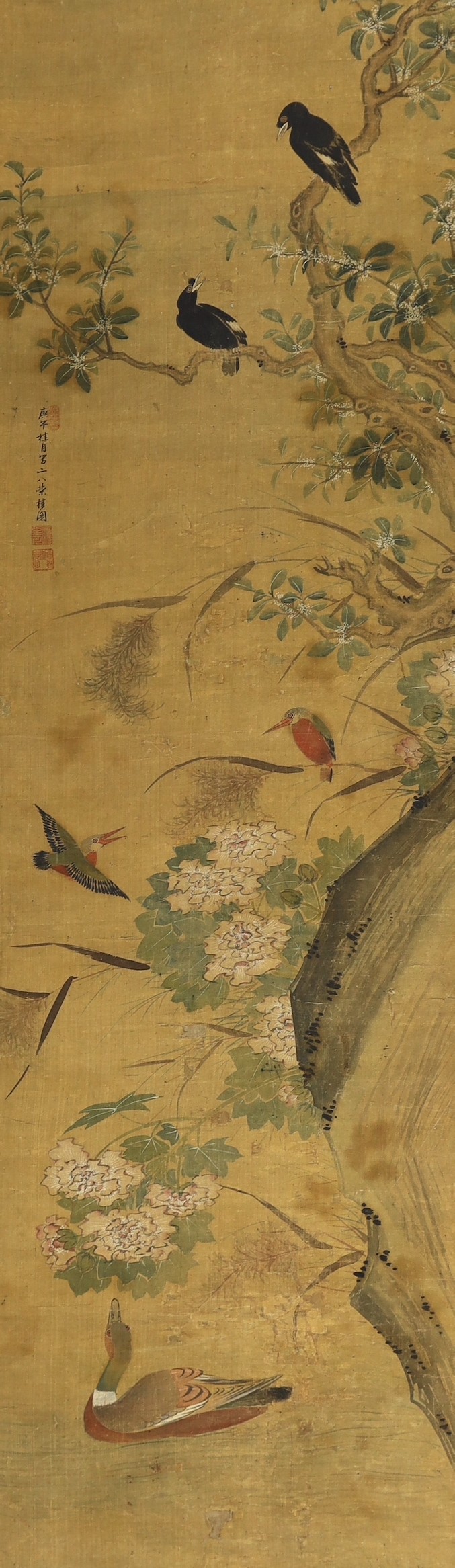 A Chinese scroll painting on silk of birds, rockwork and plants overhanging a pond, 19th century, image 164.5cm x 50.5cm